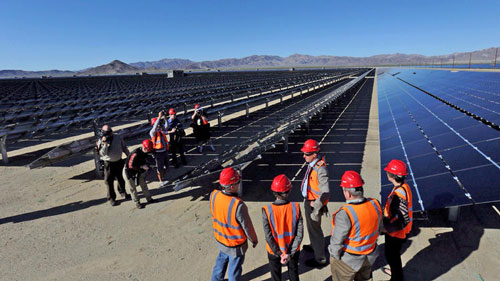 U.S. Interior Secretary Sally Jewell gets a tour with officials of the new Desert Sunlight Solar Farm in Desert Center, Calif. (Marcus Yam / Los Angeles Times)